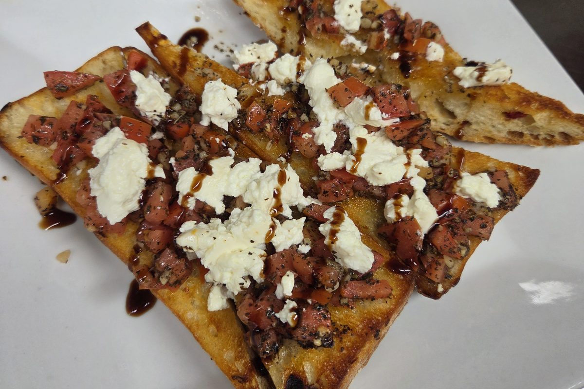 Bruschetta topped with feta and balsamic glaze