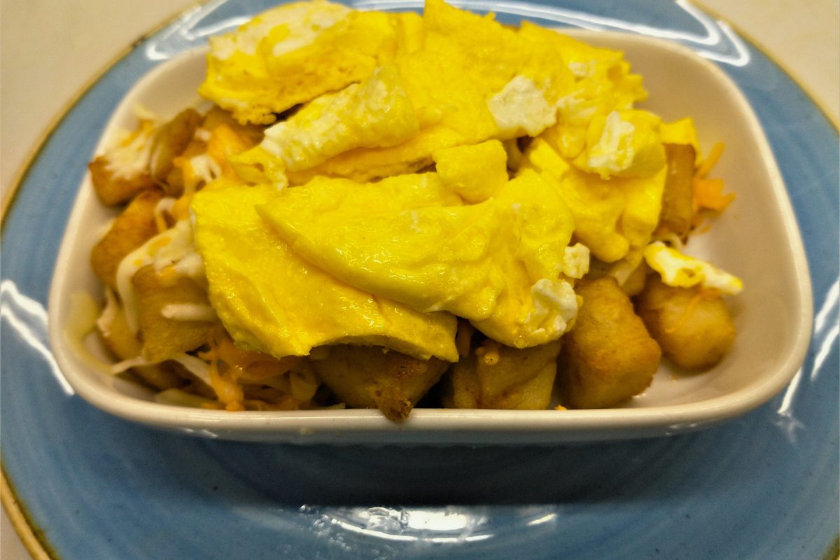 Breakfast skillet with scrambled eggs and cheese