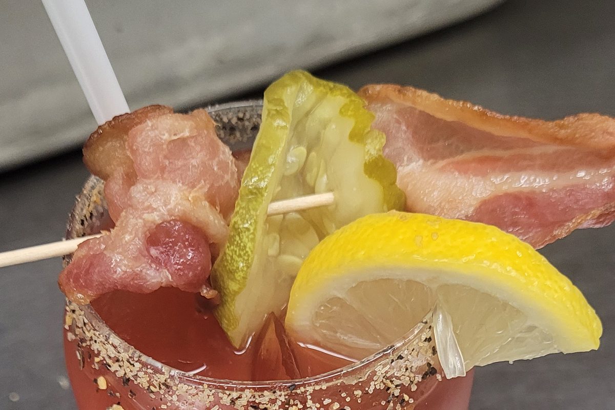 Caesar cocktail with bacon, pickle and lemon