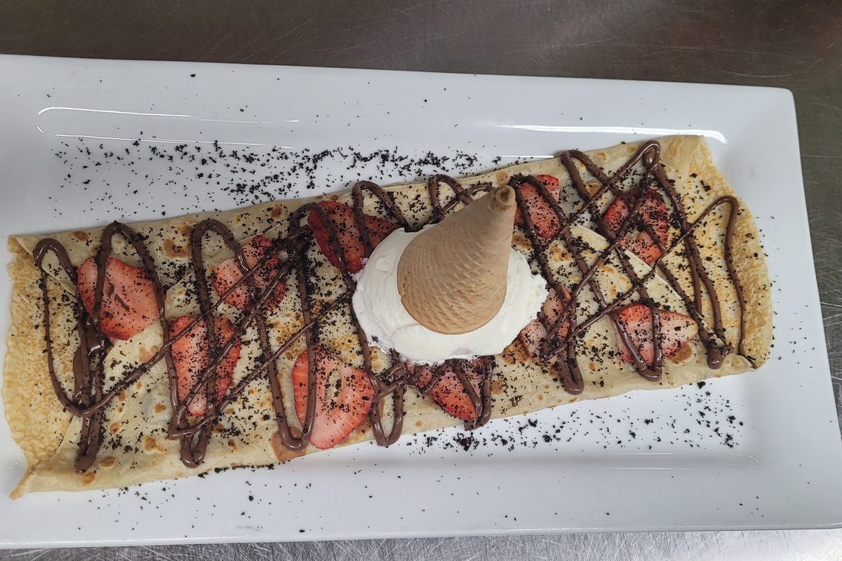 Strawberry Nutella Oreo crepe with an ice cream cone