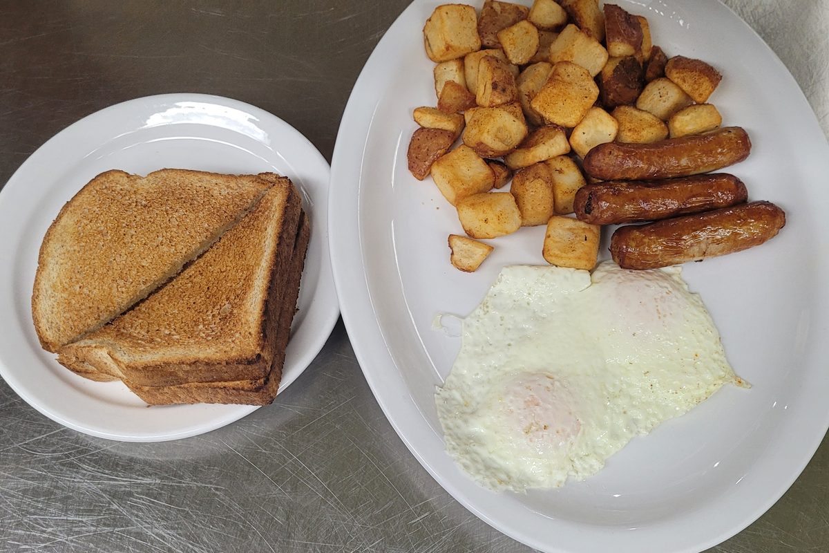 Two eggs, sausages, homefries and toast
