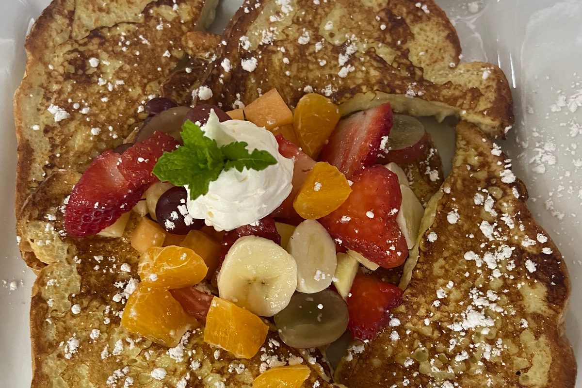 French toast topped with fresh fruit and whipped cream