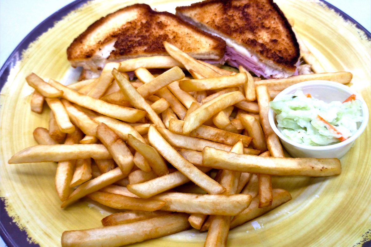 Grilled cheese sandwich with fries and coleslaw