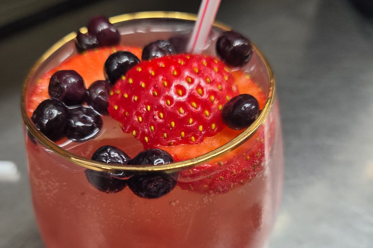 Lemon lavender fizz mocktail with blueberries and strawberry