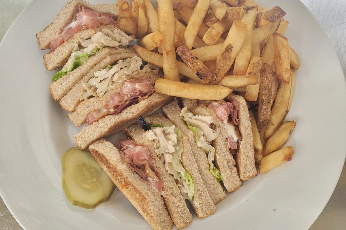 Clubhouse sandwich with fries